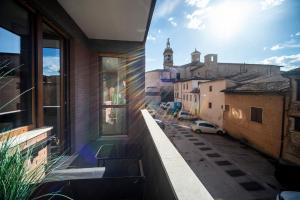 a view of a street from a balcony of a building at Sant'Angela Rooms in Foligno