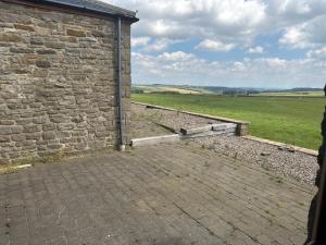 an outside view of a brick wall and a field at Thornley pit house farm in Durham