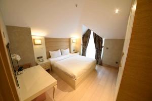 a hotel room with a bed and a window at Le Mirage Hotel in Istanbul