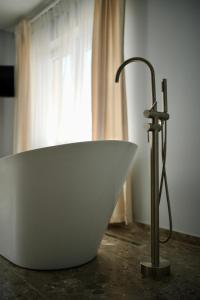 a white bath tub sitting in front of a window at Imperial Hotel in Bukovel +114 photos