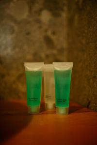 two cups of green liquid sitting on a table at Imperial Hotel in Bukovel