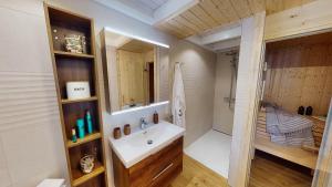 a bathroom with a sink and a shower at Strandhaus Rügenperle - Baabe in Baabe