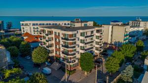 an overhead view of a building with the ocean in the background at Apartaments PopDan Residence by the Sea in Eforie Nord