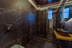 a bathroom with a sink and a toilet at Apartaments PopDan Residence by the Sea in Eforie Nord +58 photos