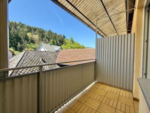 an empty balcony with a view of a roof at Gästehaus Kremser in Weiten