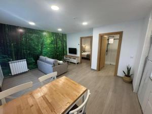 a living room with a couch and a table at Hostal Casa Otsoa in Ezcároz