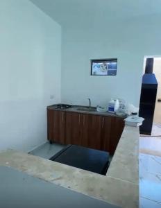 a view of a kitchen with a counter top at Airport Chalet مزرعة وشاليه المطار in Amman +11 photos