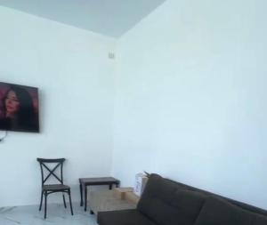 a living room with a couch and a chair at Airport Chalet مزرعة وشاليه المطار in Amman