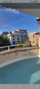 a view of a building from the top of a swimming pool at LeoneG in Năvodari