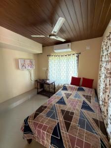 a bedroom with a bed in a room at Hayath Homes in Athirappilly