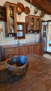 a kitchen with a large stone bowl on a table at Lekania House in Káto Nisí