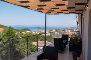 a balcony with chairs and a view of the ocean at PERDIKA's HORIZON in Perdika