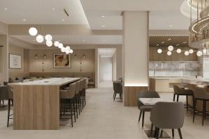a dining room with a long table and chairs at AC Hotel by Marriott Denver RiNo in Denver