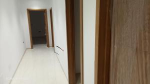 an empty hallway with a door and a room at Elin house in Hammamet
