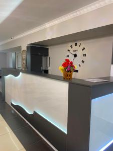 a reception counter with a clock on the wall at Khan-toru in Pokrovka