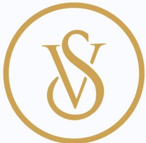 a gold letter s in a circle logo at Hotel V Square in Lucknow
