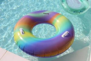 a colorful inflatable raft in a swimming pool at Lôu cayrou in Beaumarches