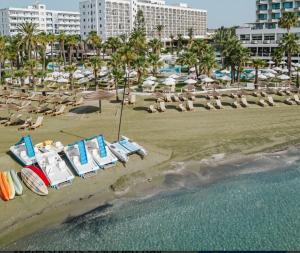 an aerial view of a beach with chairs and umbrellas at IOLENA Two Bedroom SEAVIEW APT in Pyla