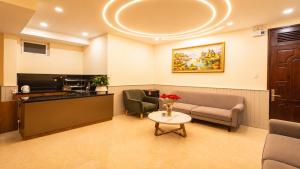 a waiting room with a couch and a table at Lien's 2 Hotel Dalat in Da Lat