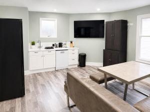 a kitchen with a couch and a table in a room at The Stables in Market Rasen