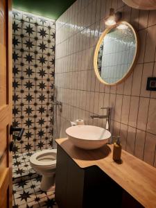 a bathroom with a sink and a toilet at Vikendica Jagodica in Ivanjica