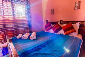a bedroom with a swimming pool on the bed at Kasbah Imlil in Imlil
