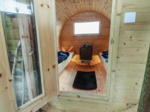 a tiny house with a tunnel in the middle at The Herdsman Luxury Shepherds Hut in Barnoldswick