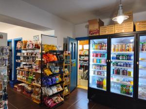 a store filled with lots of food and drinks at Ammoudia Studios in Agiassos