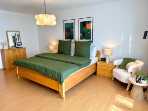 a bedroom with a large bed and a couch at Ferienhaus Burgblick am Hang in Bernkastel-Kues +12 photos