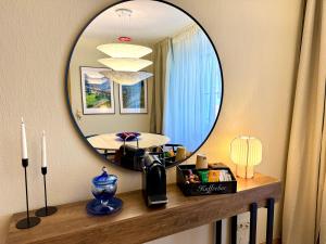 a mirror on a wall above a counter with a room at Ferienhaus Burgblick am Hang in Bernkastel-Kues