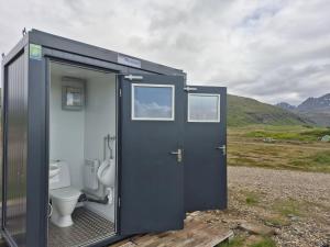 a black container with a toilet inside of it at Stafafell Ready Tents in Stafafell