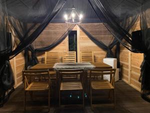 a dining room with a table and chairs at 蔵Mping Hotel in Fukaya