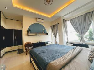 a bedroom with a bed and a desk in it at Annie.homestay 12NM in Nha Trang