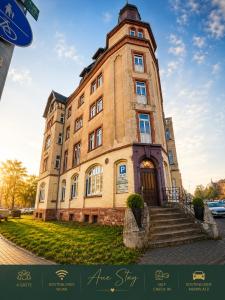 a large brick building with a clock tower at Aue Stay in Kassel