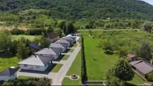 an overhead view of a row of houses in a field at Lohovo Arena in Bihać