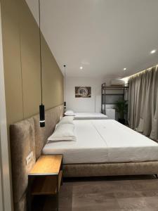 a bedroom with two beds in a room at Vila Marjana in Sarandë +193 photos