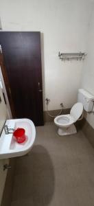 a bathroom with a toilet and a sink at Hotel Casa viora at swimming pool in Calangute +40 photos