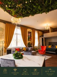 a living room with a couch and a table at Aue Stay in Kassel