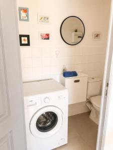 a white washer and dryer in a bathroom at L'oléastre en Luberon 2 in Grambois +7 photos