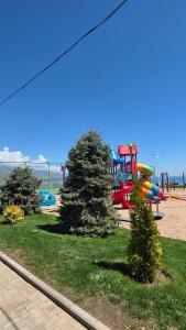 a park with a playground with a play park at Cottage in Bosteri
