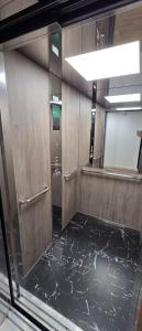 an empty train room with a door and a mirror at hugotel in Francescas