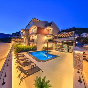 an image of a house with a swimming pool at Serenity Pearl in Kaş