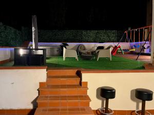 a set of stairs with chairs and a stage at Empoli Charm in Empoli