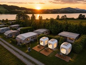 an aerial view of a group of domes at sunset at Cubes am Irrsee - SELF CHECK-IN in Sommerholz
