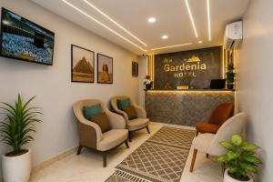 a waiting room at a hotel with chairs and a counter at New Gardenia Pyramids - Rooftop in Cairo +47 photos