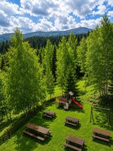 an aerial view of a park with picnic tables and a playground at Hotel Karolinka in Karpacz