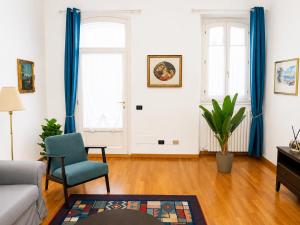 a living room with a couch and a chair at Rainbow District Mood Villa in Milan +42 photos