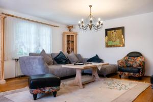 a living room with a couch and a table at Villa Euphoria in Theológos