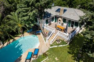 an aerial view of a house with a swimming pool at Villa Euphoria in Theológos