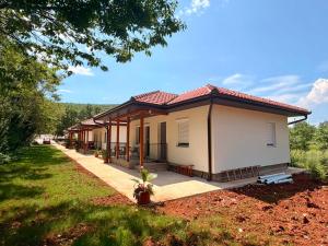 a house with a pathway leading to it at Captain's Oasis in Budva